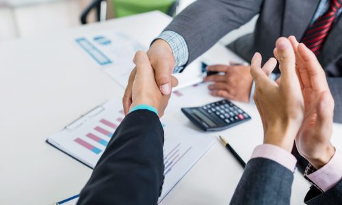 Successful businessman handshake at meeting. Congratulations and Confirmation in the agreement investment together.